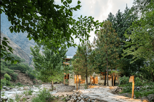 A Riverside Cottage Amidst Lush Greens Of Tirthan Valley Image