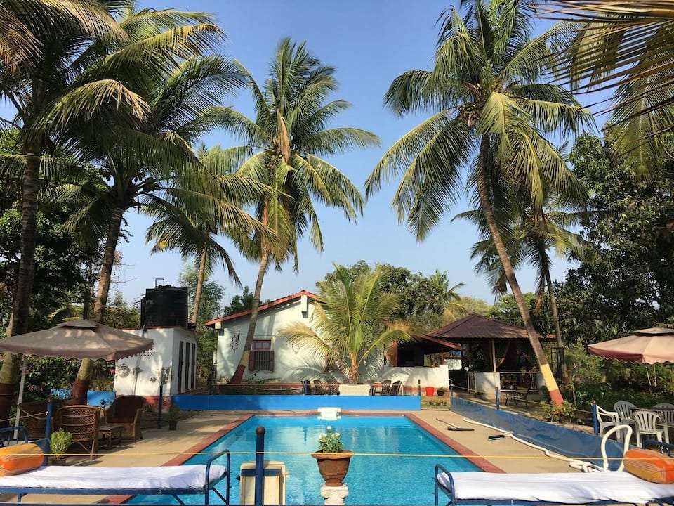 A Peaceful Villa Amidst Tall Palm Trees In Alibaug