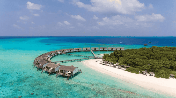 Astonishing aerial view of the Water Villas at Reethi Beach Resort