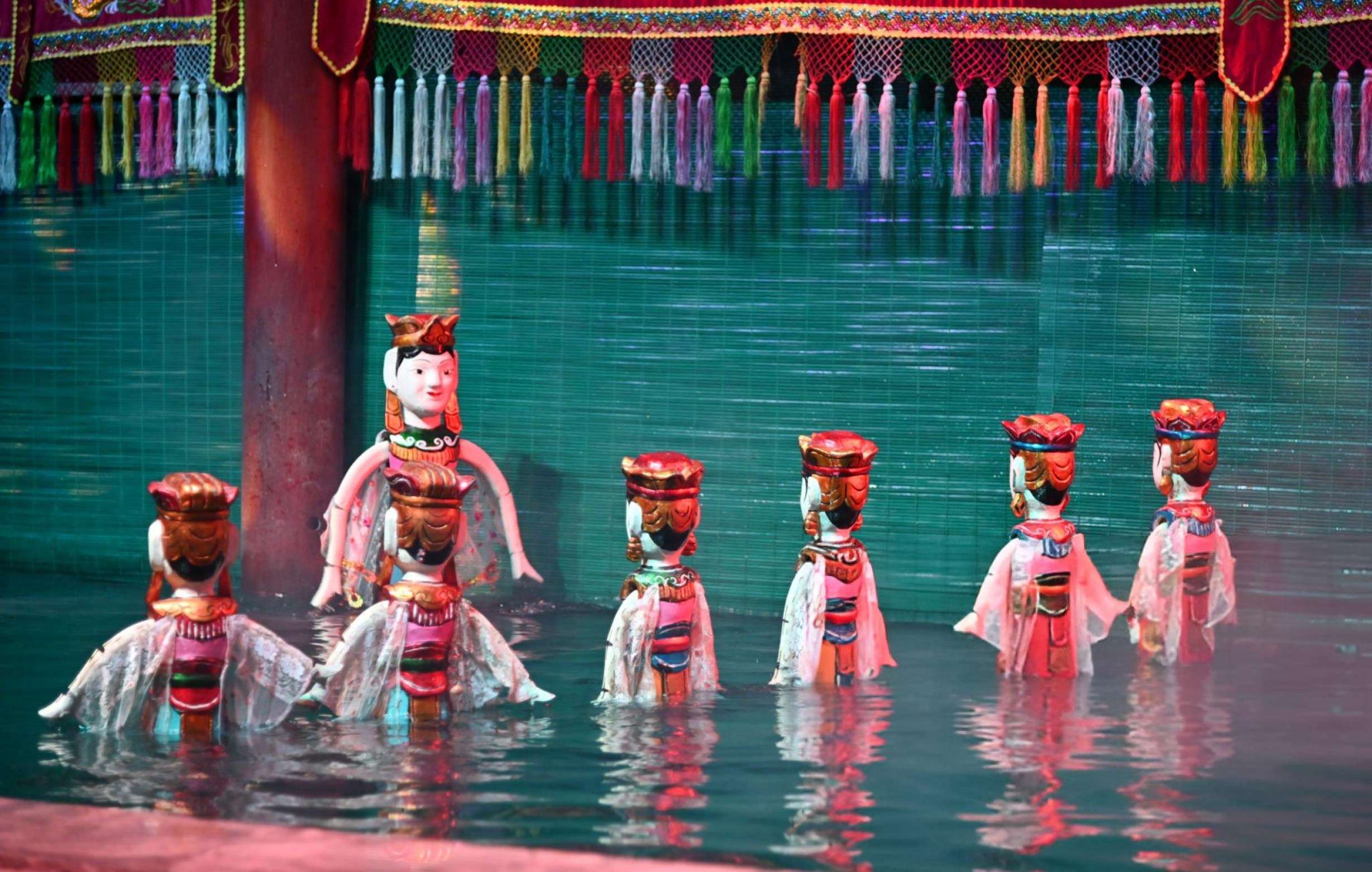 Witness a harmonious blend of storytelling, music, and puppetry in a water setting in Hanoi