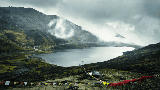 Marvel at the high-altitude Tsomgo Lake framed by the snow-capped peaks