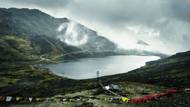 Marvel at the high-altitude Tsomgo Lake framed by the snow-capped peaks