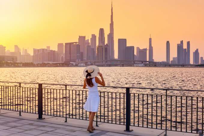 Tourist enjoying the view from Dubai Creek