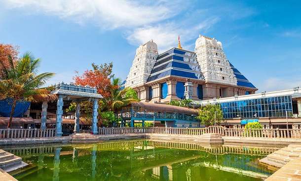 Immerse yourself in vibrant rituals and devotional chants at the ISKCON Temple