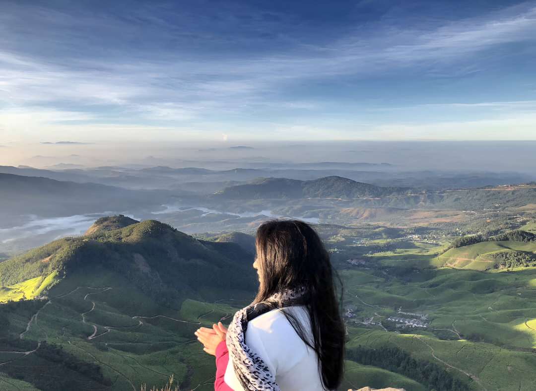 Embark on the Kolukkumalai Tea Estate Trek, starting with an overnight journey from Bangalore