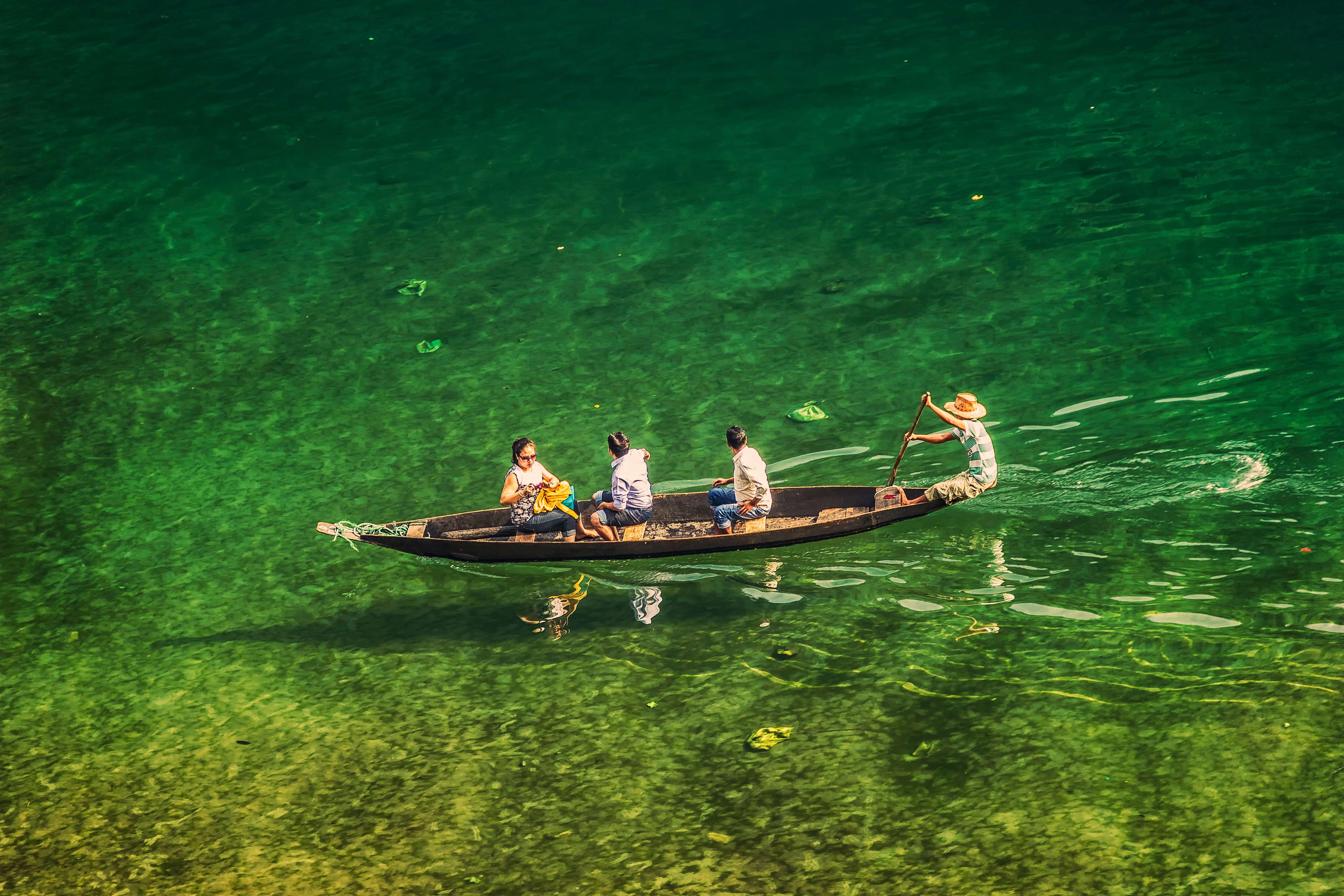 Tourists enjoying a boat ride in Dawki