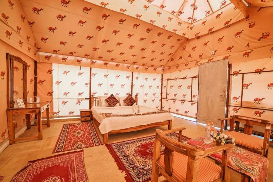 Experience starlit nights, folk shows, and desert charm with an overnight stay in Jaisalmer