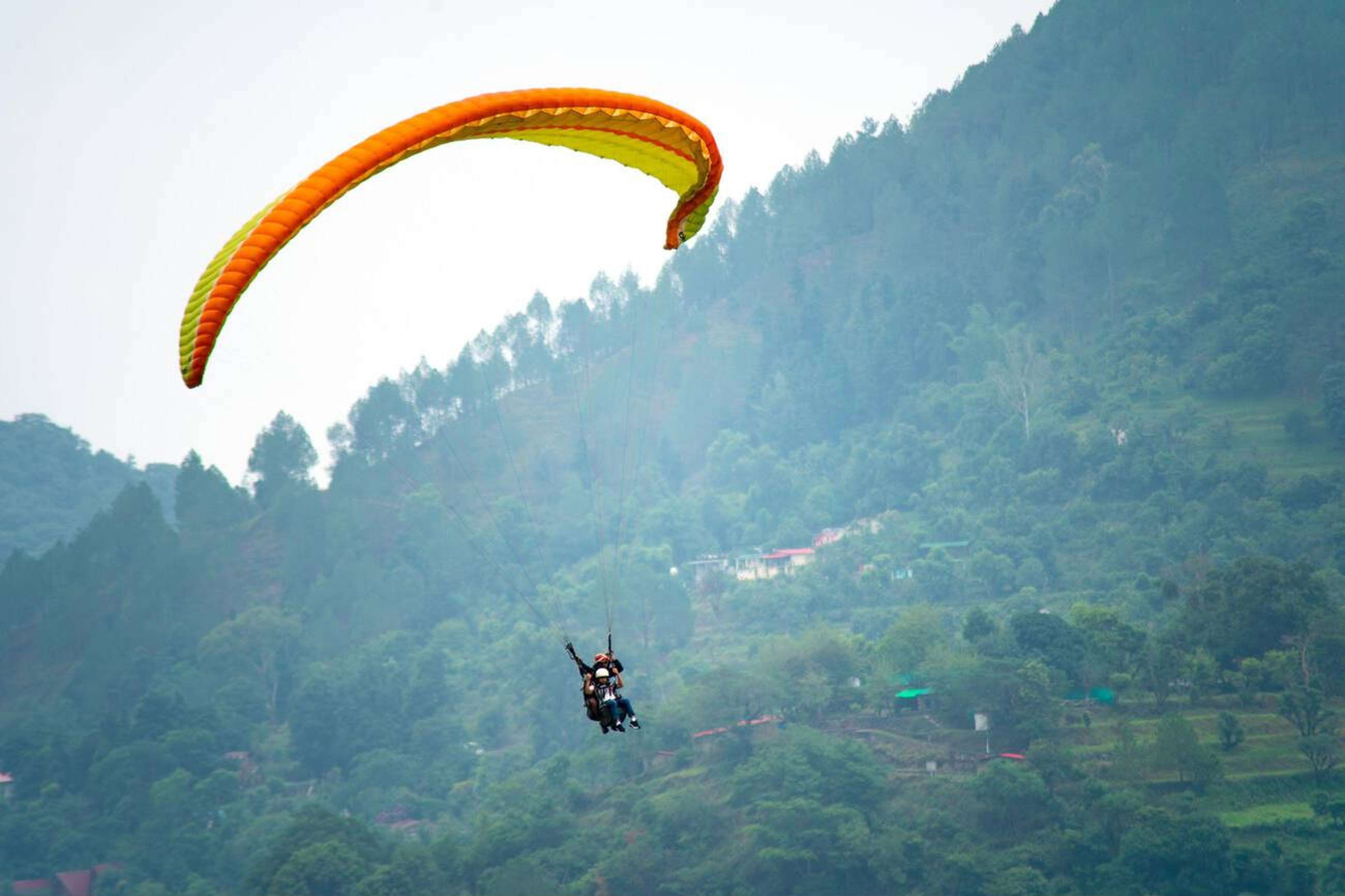 Experience 10 minutes of Paragliding near Sattal Lake
