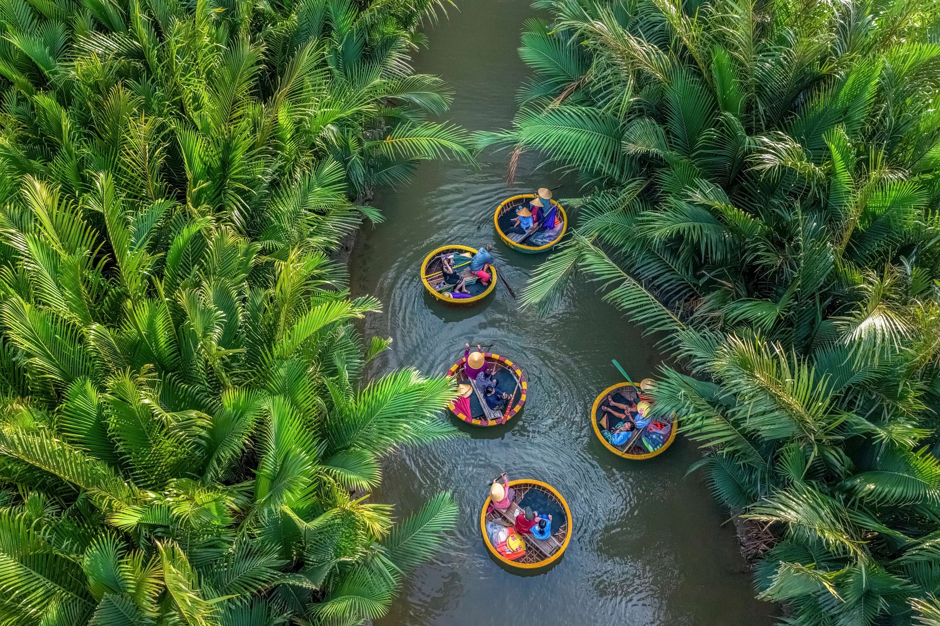 Tourists enjoying on the basket boats in Hoi An