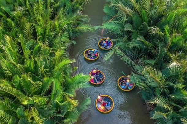 Tourists enjoying on the basket boats in Hoi An