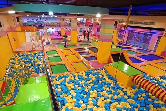 Soar through the air as you jump and flip on the high-quality trampolines at SkyJumper GoBananas, Noida