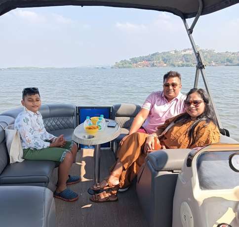 Enjoy quality time with your family on the cosy seating of a lounge boat, surrounded by the serene waters