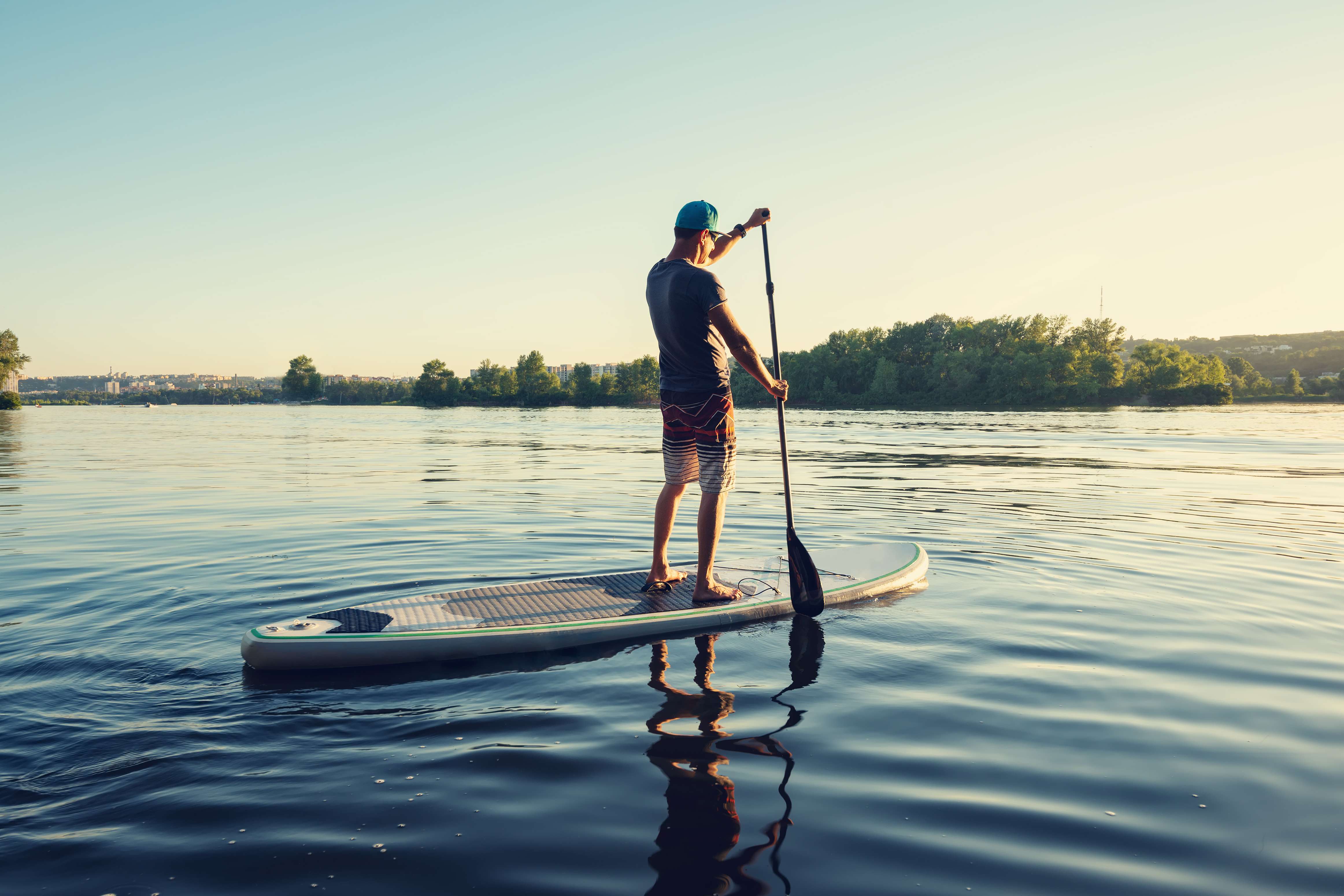 Stand-up paddleboarding, an adventure perfect for both beginners and seasoned paddlers