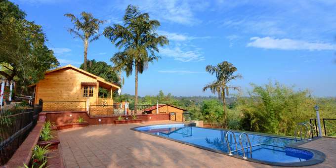 A Wooden Vacation Retreat with Serene Lake views in Goa