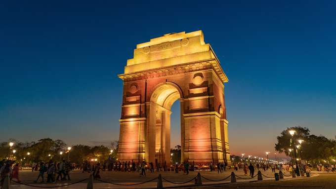 Explore Delhi's iconic landmarks, including a tranquil walk around India Gate, on an immersive 16-hour sightseeing tour