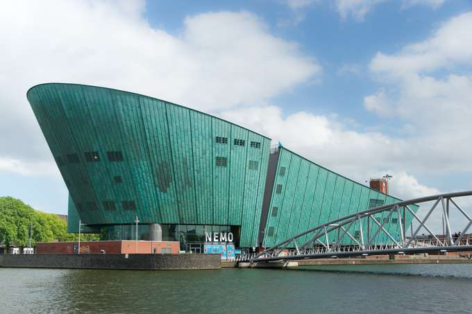 Beautiful view of the Nemo Science museum with the IJ river car tunnel.