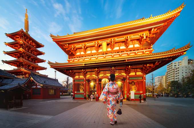 Girl posing in front of Senso-ji Temple, Asakusa, Tokyo