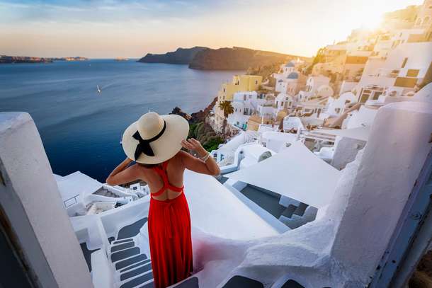 Woman admiring the view of Santorini