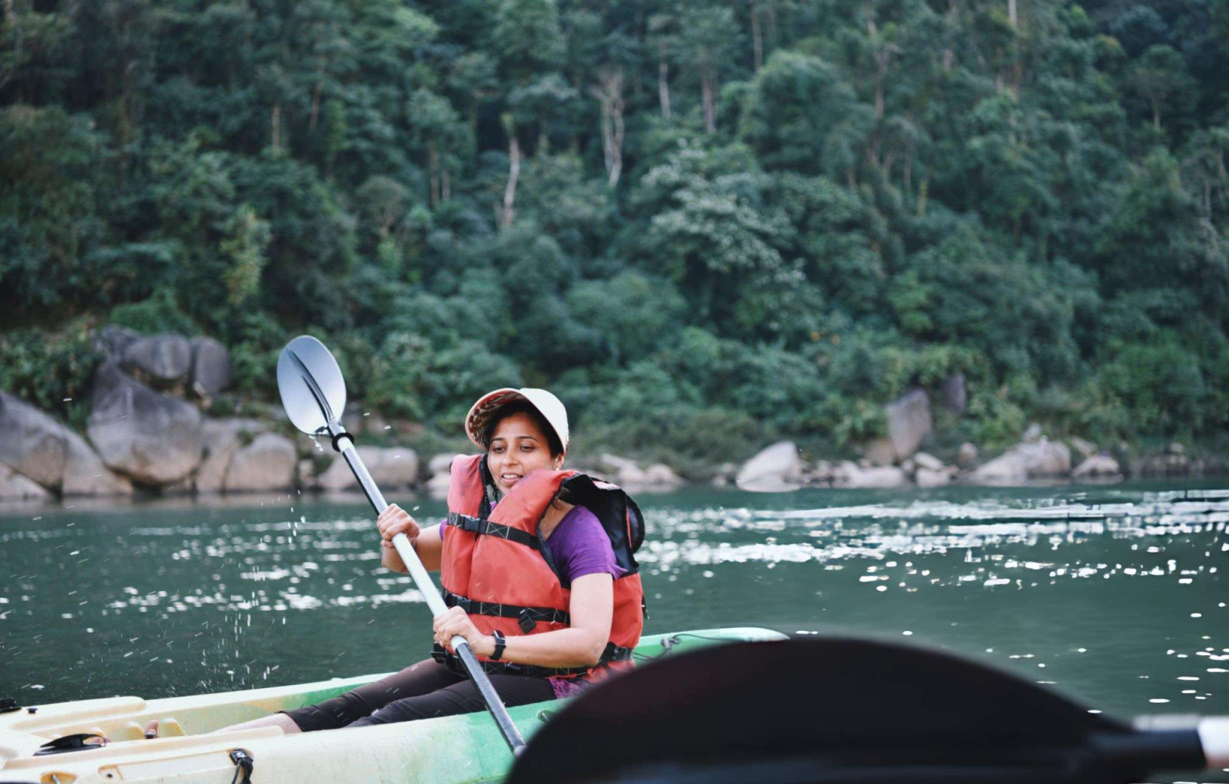 Paddle through Umkhakoi Lake's clear waters surrounded by lush forests