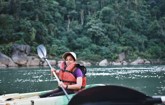 Paddle through Umkhakoi Lake's clear waters surrounded by lush forests