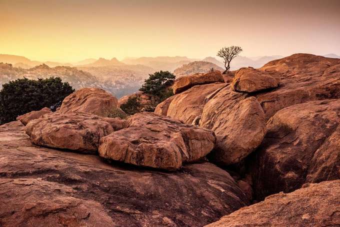 Visit the Hemakuta Hill along with other attraction on the 10 hour sightseeing tour of Hampi