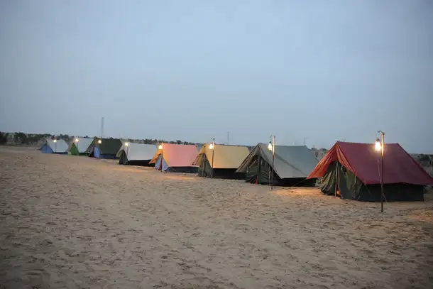 Enjoy rustic charm with modern comforts in a serene setting during an overnight desert camping