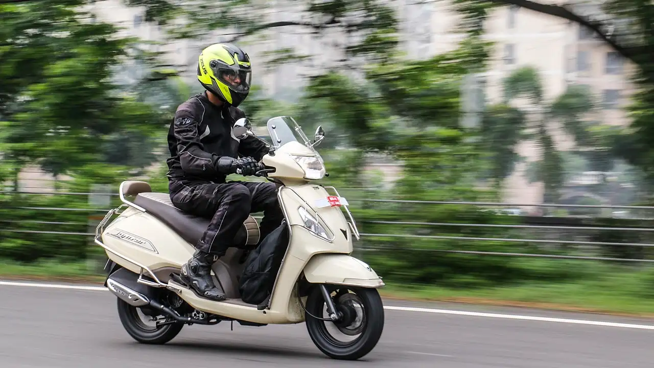 Enjoy a scooty ride through the vibrant streets of Hyderabad