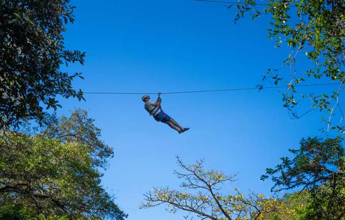 Soar through the treetops on a thrilling zipline ride and take in the breathtaking views 