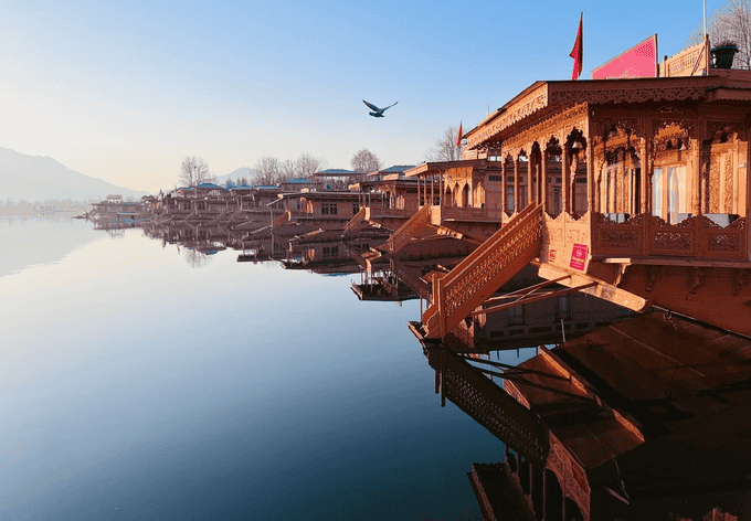 Relax on a traditional houseboat surrounded by serene Dal Lake waters