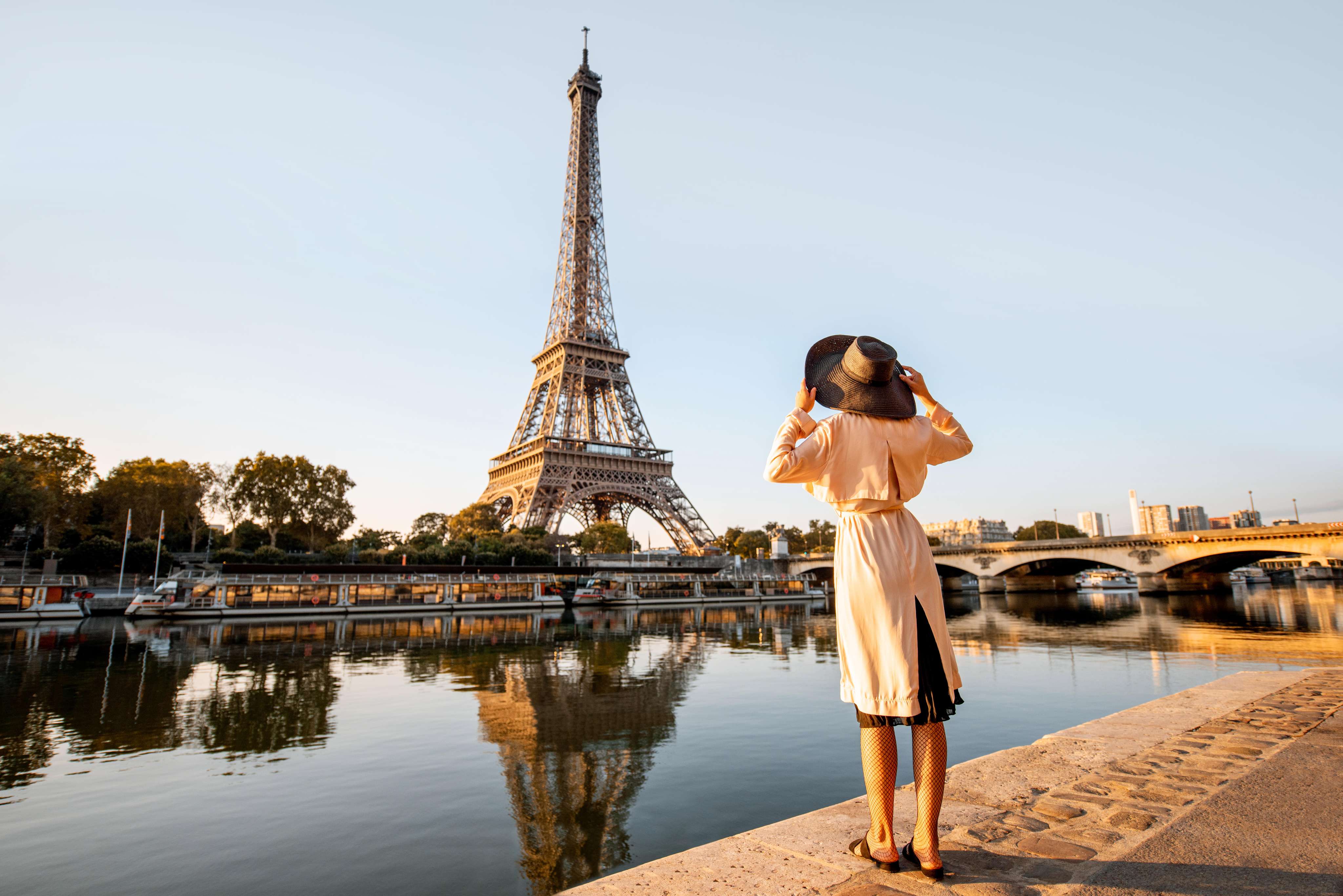 Stroll along the Seine River and admire the Eiffel Tower rising gracefully against the Parisian sky