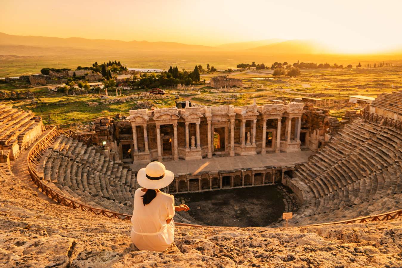 Tourist enjoying sunset at the old Amphitheater