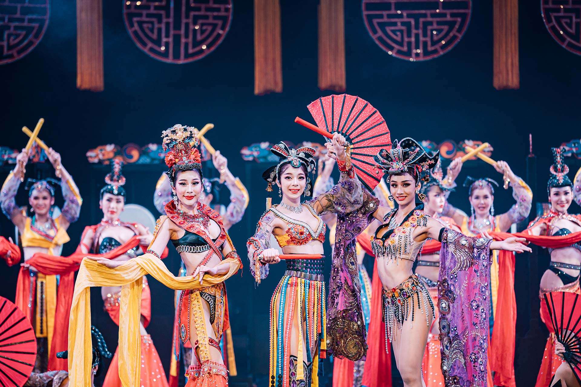 Watch performers light up the stage in sparkling outfits