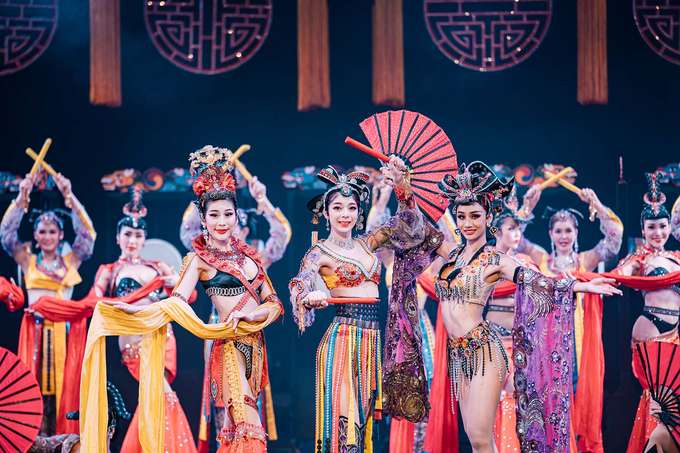 Watch performers light up the stage in sparkling outfits