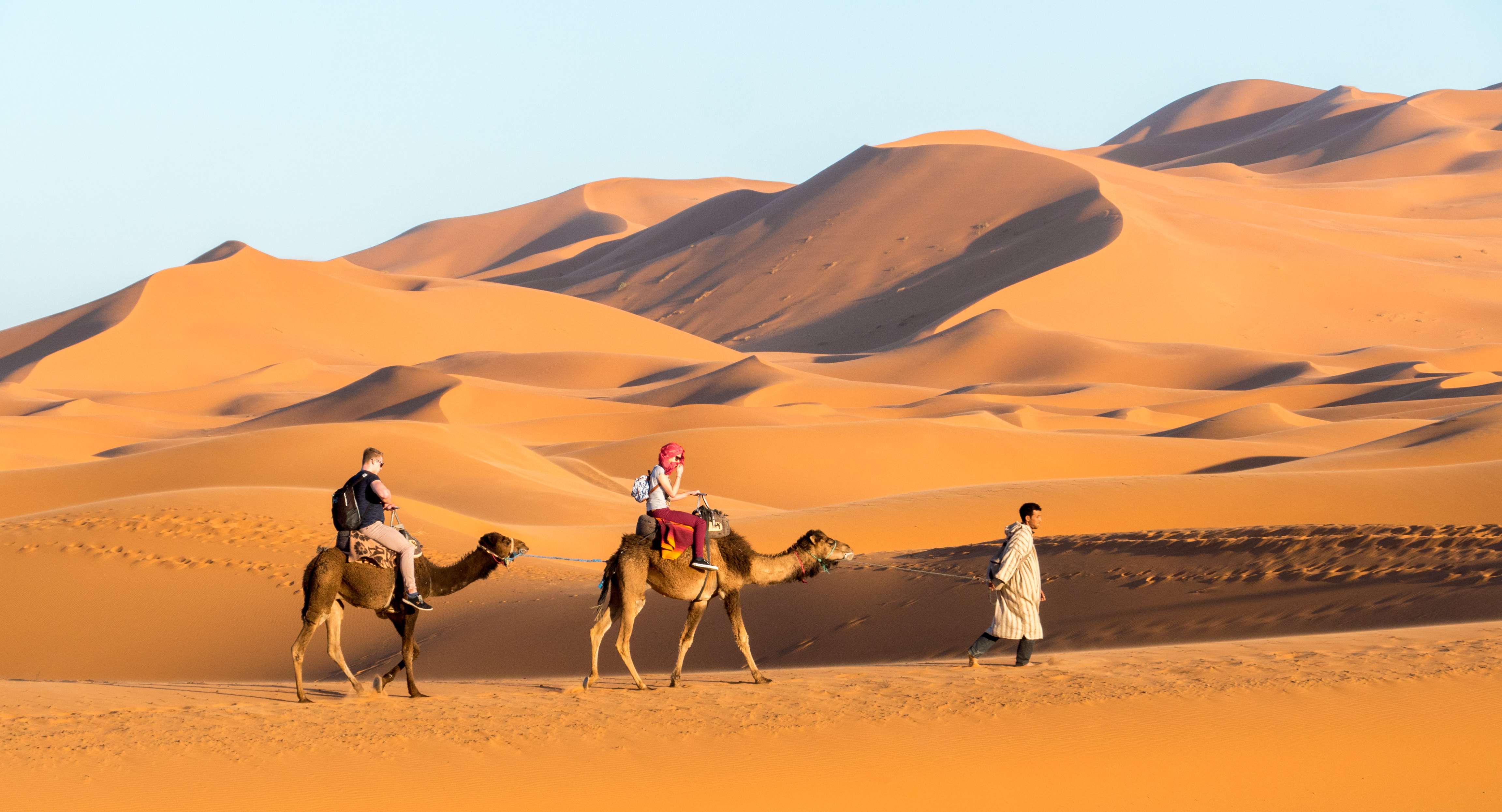 Enjoy a camel ride with your partner cross the iconic Sahara desert