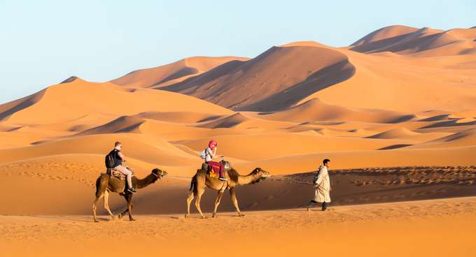 Enjoy a camel ride with your partner cross the iconic Sahara desert