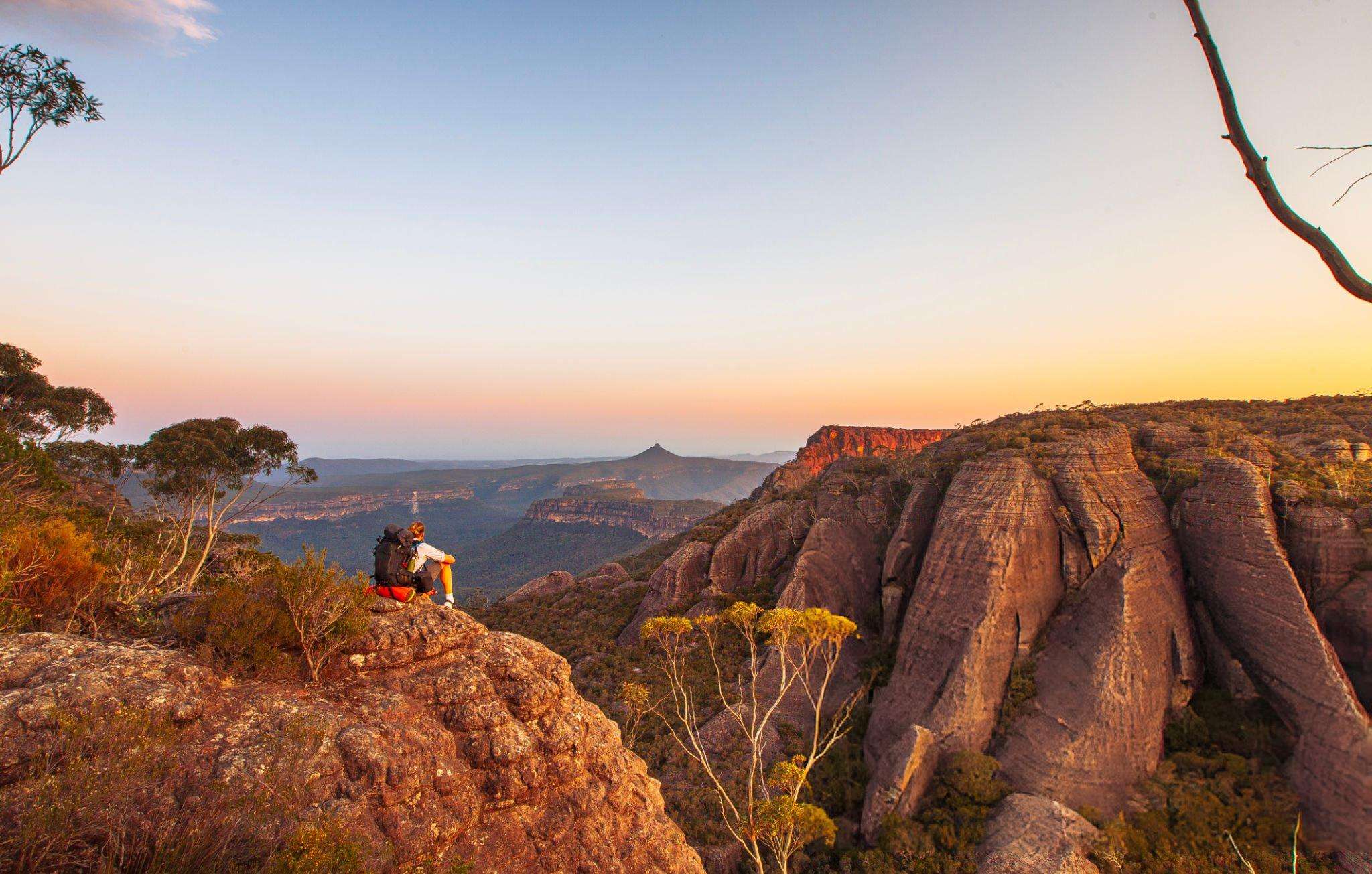 Marvel at the scenic surroundings as you ascend to rocky mountains in Uluru