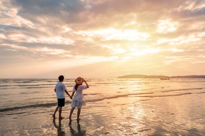 Couple walking on Kovalam's beach