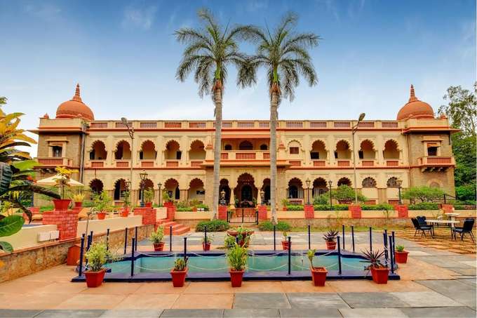 WelcomHeritage Shivavilas Palace with a pool view, Hampi