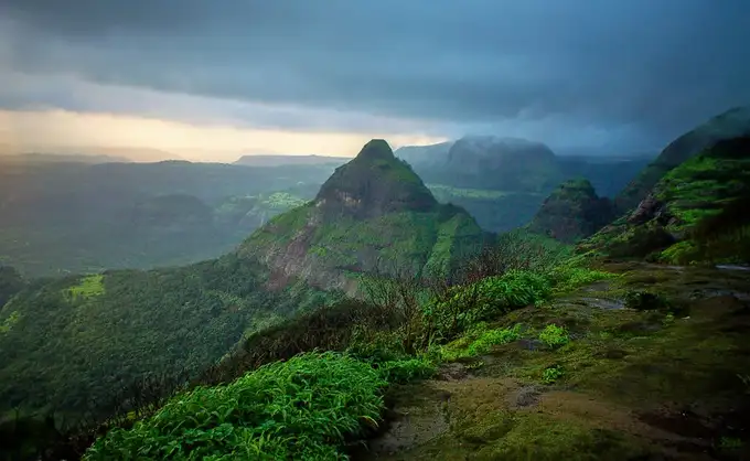 Admire the lush green valleys and hills of Mahabaleshwar, a hill station in Maharashtra