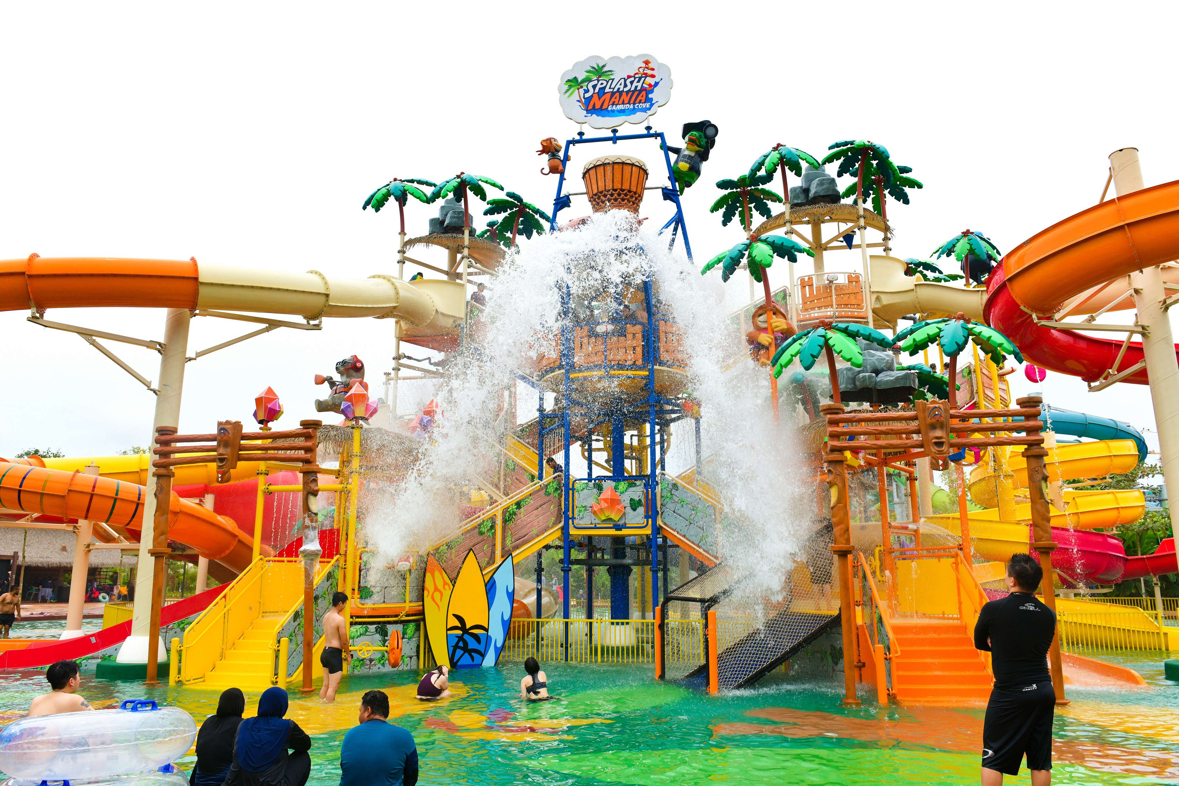 Embark on a massive slide combo featuring multiple flumes, splash buckets, and water features at Treasure Tower