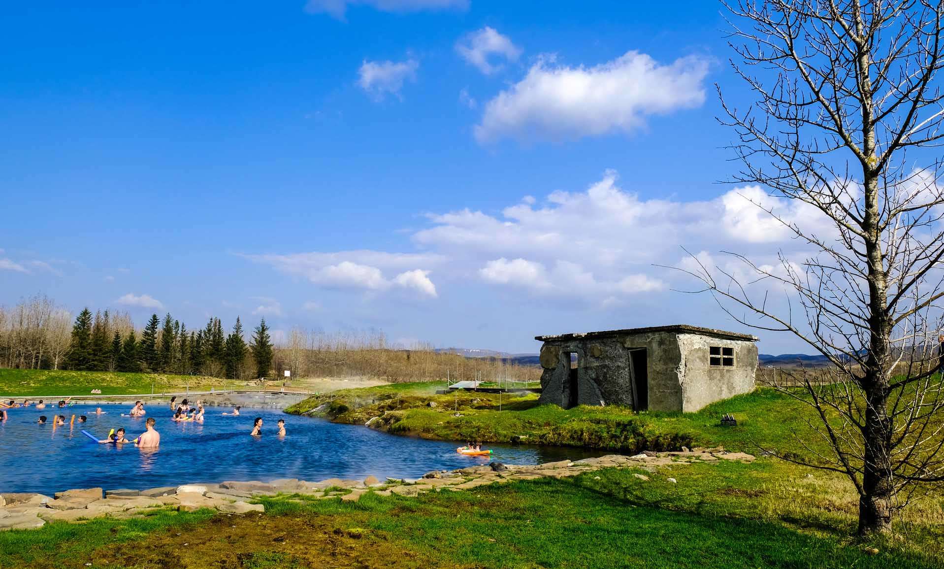 Visit Secret Lagoon Hot Spring in Flúðir with your family and friends