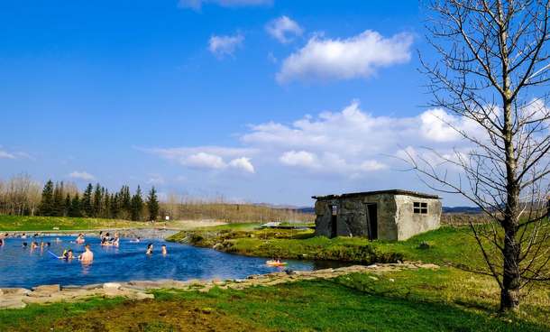 Visit Secret Lagoon Hot Spring in Flúðir with your family and friends