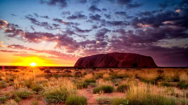 Admire the vast beauty of Uluru-Kata Tjuta National Park.