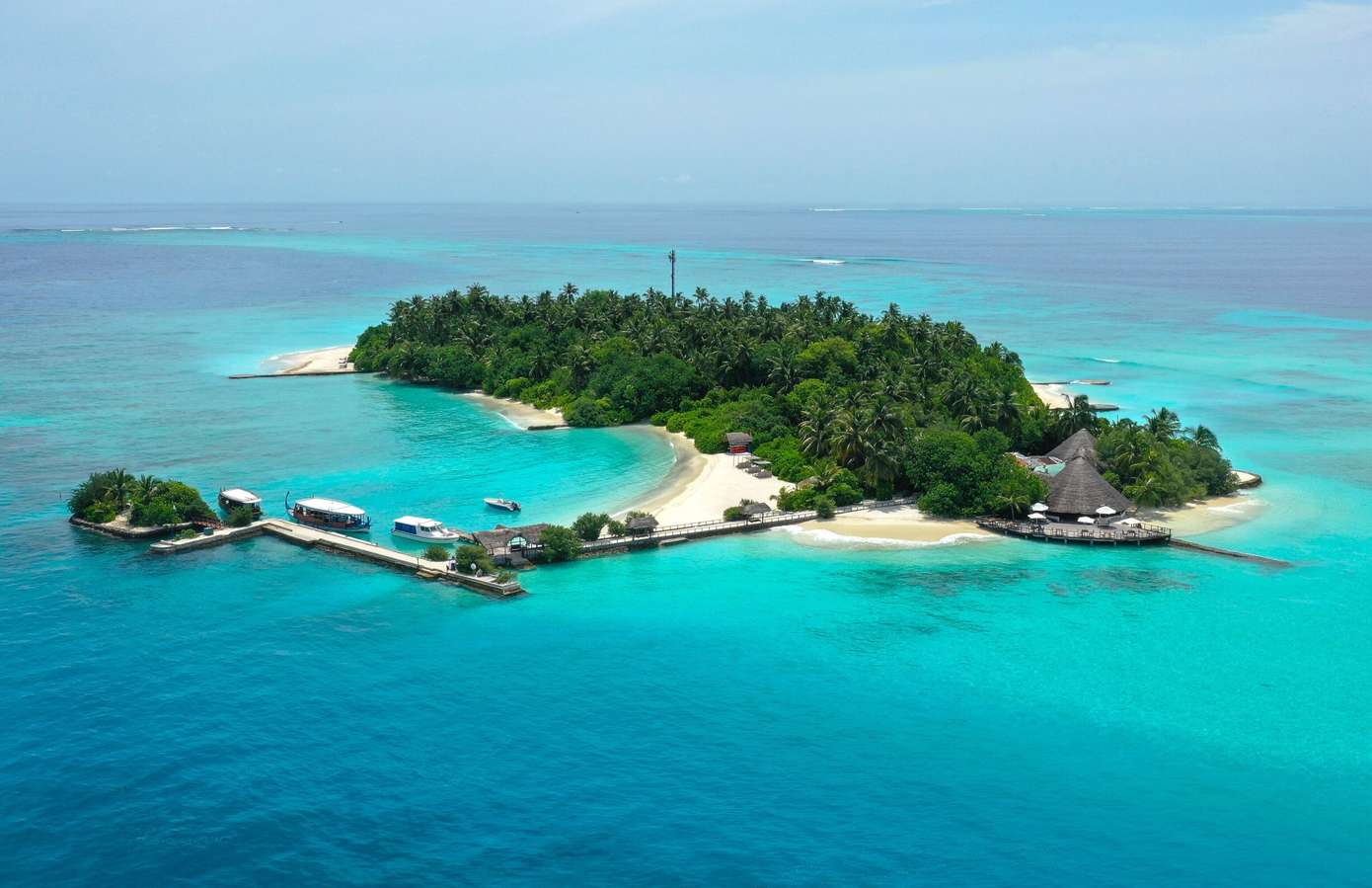 Stay in a beachfront bungalow, steps away from the turquoise lagoon