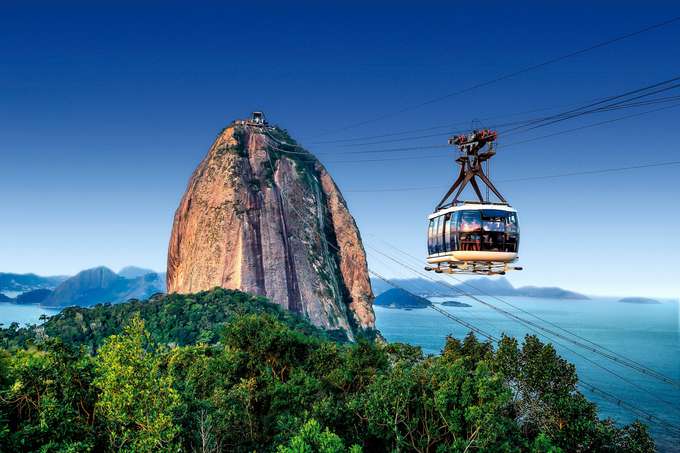 Soar above Rio as the Sugarloaf Cable Car glides over Guanabara Bay