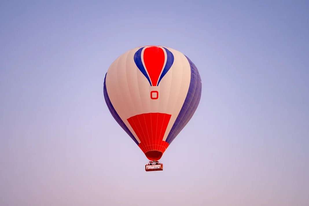 Unwind above the dunes with golden skies and gentle breezes