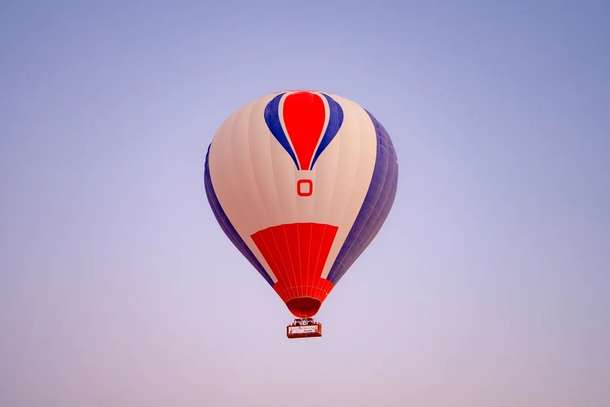 Unwind above the dunes with golden skies and gentle breezes