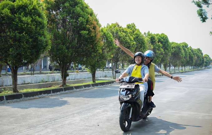 Feel the thrill of riding on open roads with your scooty rental