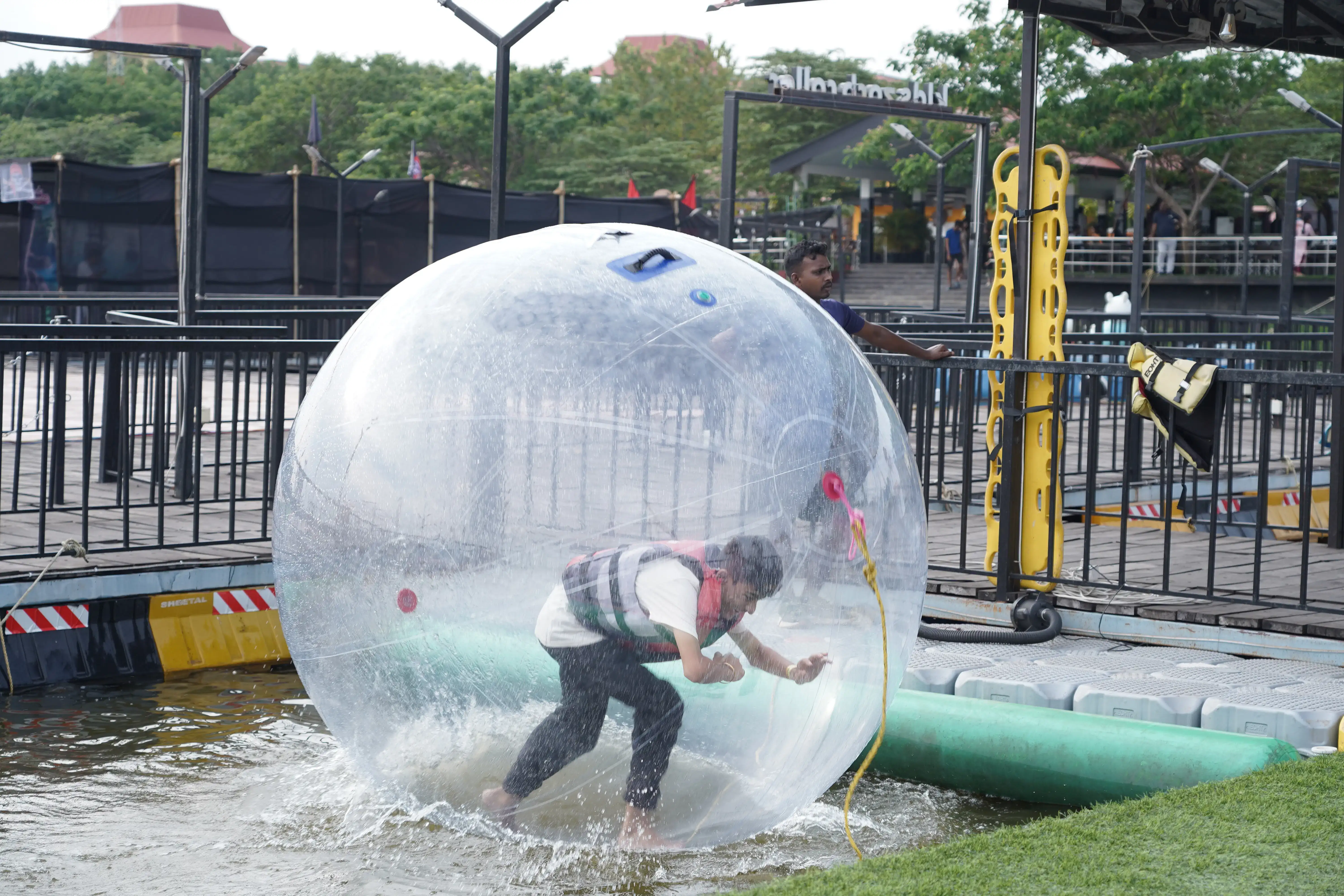 Roll, bounce, and spin freely inside a transparent sphere on the lake’s surface