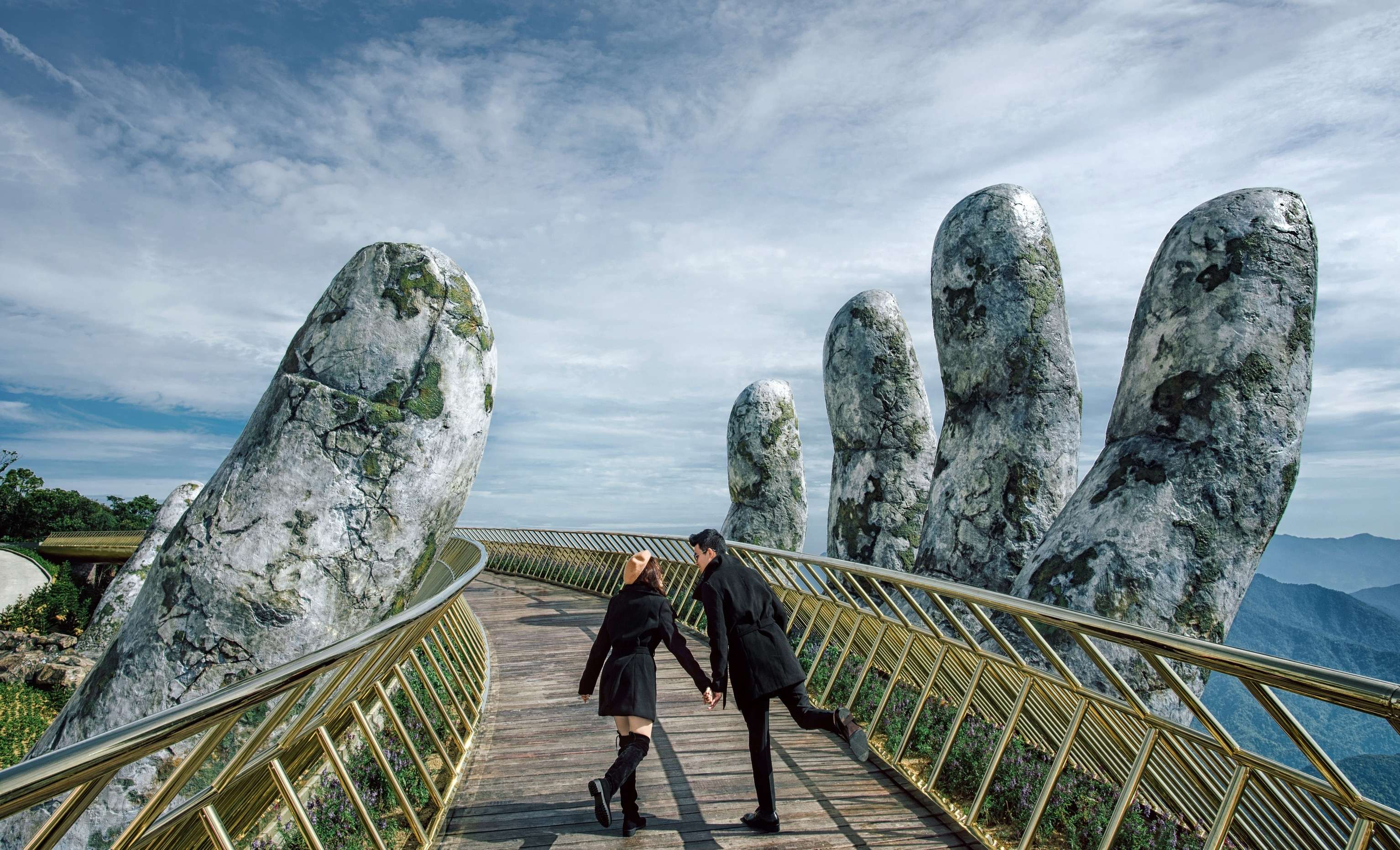 Couple posing at Golden Hand Bridge